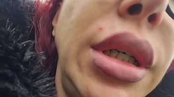 &quot_A red-haired woman with full lips sits on a park bench, letting out loud burps without a care in the world