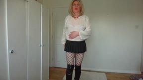 Black fishnets, miniskirt and see-through blouse