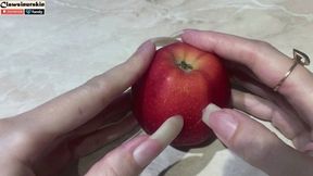 Nails pierce an apple and cut into two halves