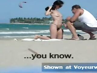 Amateur chick in topless is asking strangers on the beach to touch her worthy merry boobs