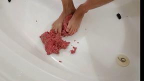 Raw Ground beef bare foot play