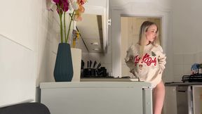 Amazingly beautiful petite blonde hot college girl in her dormitory kitchen getting ready for Christmas Party