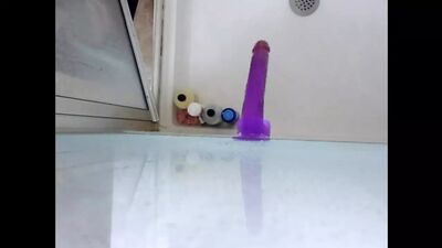 Dildo ass fucking in the shower