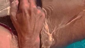 Sexy blonde milf horny from sun & water fingering herself in the outside pool cumming hard