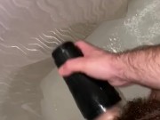 Young hairy daddy plays with flashlight in shower