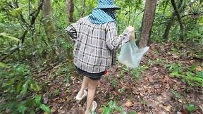 A Thai girl walks and chats while picking mu in the forest  She secretly shows off her skills in the deep forest  Her voice is clear Thai