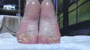 Slick oiled wrinkled soles closeup