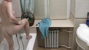 Solo teen masturbates in the shower