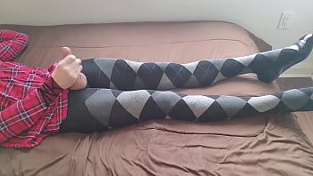 Shemale jerking off in plaid dress and argyle tights