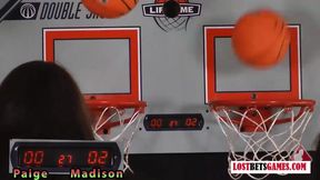 Two adorable girls play a game of strip basketball shootout