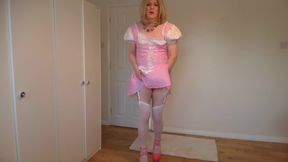 Blonde in stockings stripping out of a cute pink costume