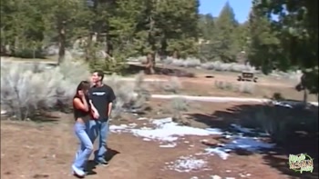 A slender Asian woman is scolded by her partner while on a vacation in the mountains