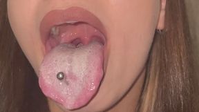 Long pierced tongue covered in thick white coat in the morning