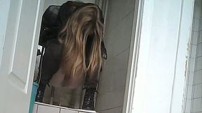Pale skin college girl in the restroom filmed from behind