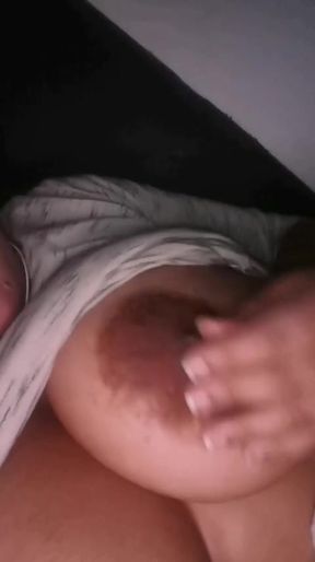 Playing with my nipples because I'm so horny