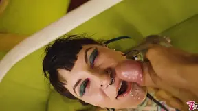 Heavily tattooed goth gags and sucks dick while slapping rear