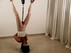 Slave in upside down bondage gets fucked deep with a toy