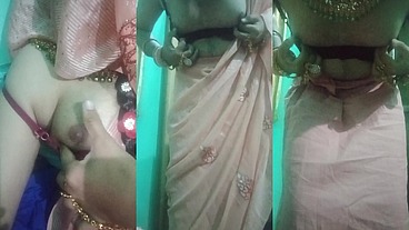 Indian trans woman Gaurisissy pressing and milking her boobs in pink saree