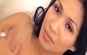 Titty brunette plays with her dick