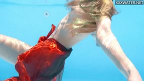 ”Petite teen Ivi Rein endures the free naked swimming”