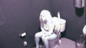 Sexy Blonde fingering her snatch public toilet