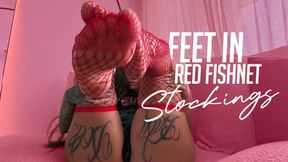 FEET IN RED FISHNET STOCKING
