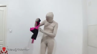 Putting on a leotard over a padlocked zentai