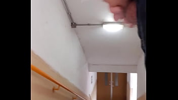 Flash dick behind a cleaner on a stair