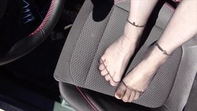 Feet of Nylonjunge in Pantyhose in Car