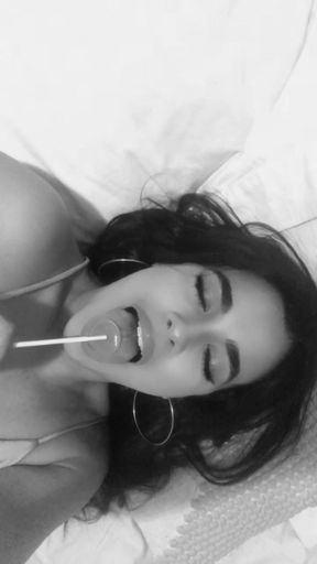 Licking a lollipop