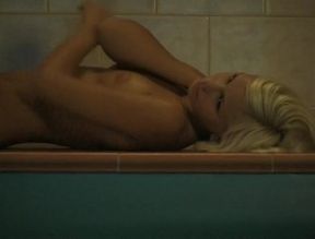 Fabulous blonde beauty gets naked by the pool