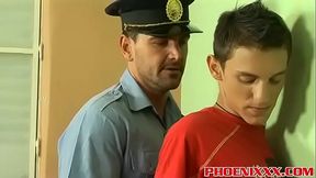 Police officer Roberts bangs hot twink Ian on a office desk