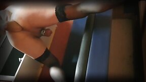 Anal fisting in a public toilet.