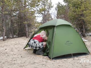 A pretty blond out of pants is assembling a tent. For lovers of peeping