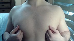 Muscular jock plays with his nipples on cam