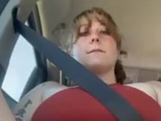 Cute gal in a petticoat fingers herself in car!