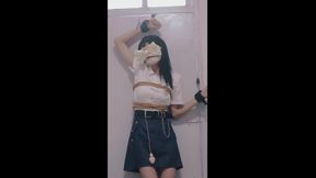 cute girl blindfolded and tied to a window