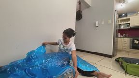 Akina blows up and pops her inflatable dolphin