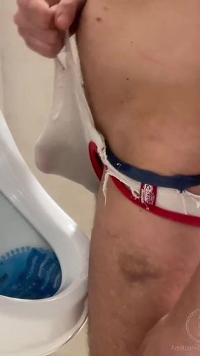 2 Boys Having Fun at the Pool Public Toilets' Urinal