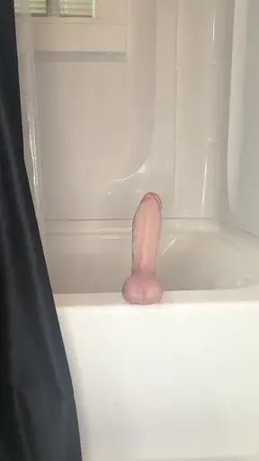 Married woman gets naughty with a huge dildo in the shower