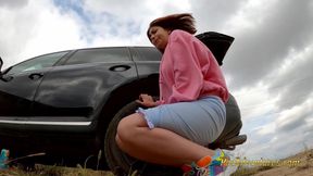Pee with her legs wide opened outdoor