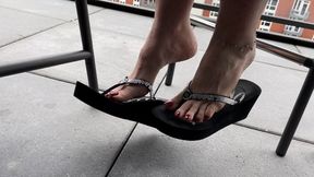 Candid Big Feet In Wedge Flip Flops Under Patio Table PART 2