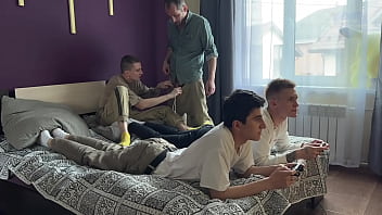 Stepfather and stepson fuck twinks in their tight asses while they play the console