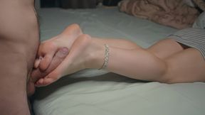 Petite girl shows her feet and does a FootJob I cum on her feet