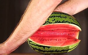 Muscular Stud Fucks and Cums on Watermelon