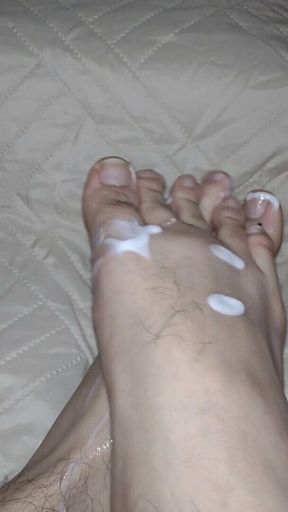 He Massages His Feet with White Cum