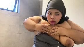 Hijabi sucking her own tits