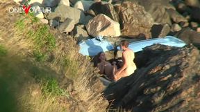 secret camera records horny young pair fucking between beach rocks