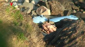 secret camera records horny young pair fucking between beach rocks