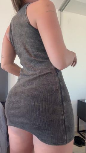 Curvy blonde in a gray dress